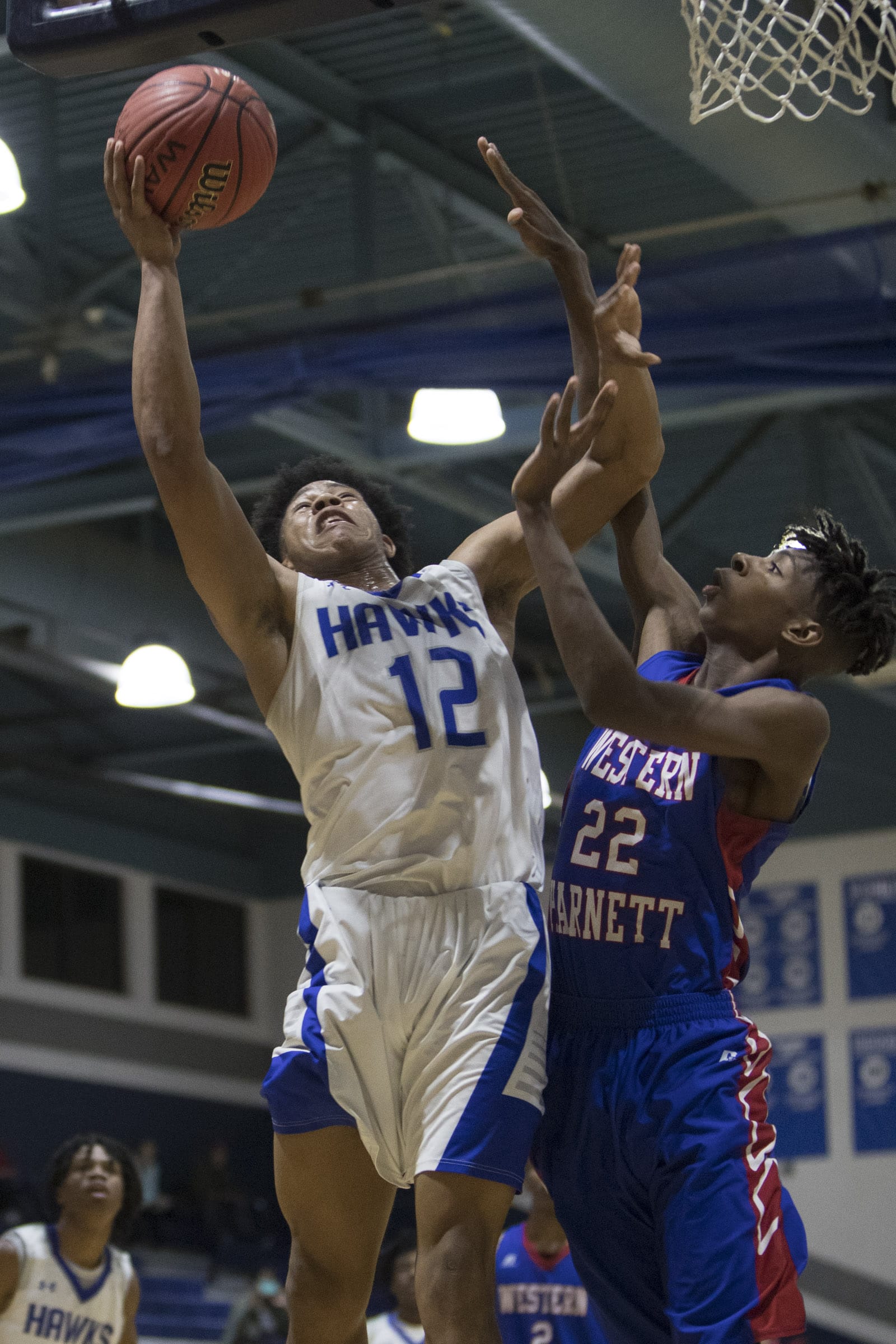 Triton boys down Western, 68-52, Lady Hawks fall in double OT