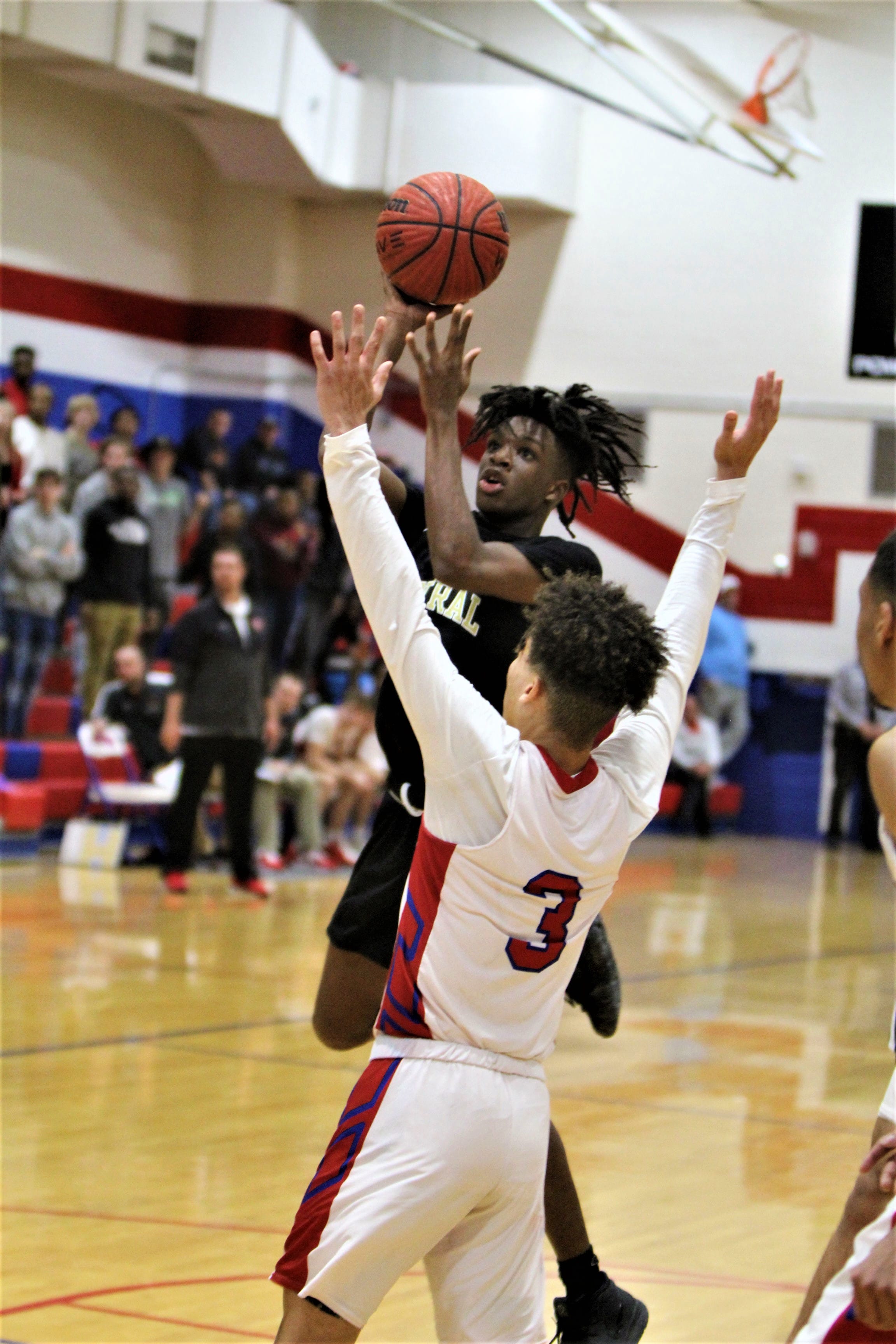 Central boys top Western in OT