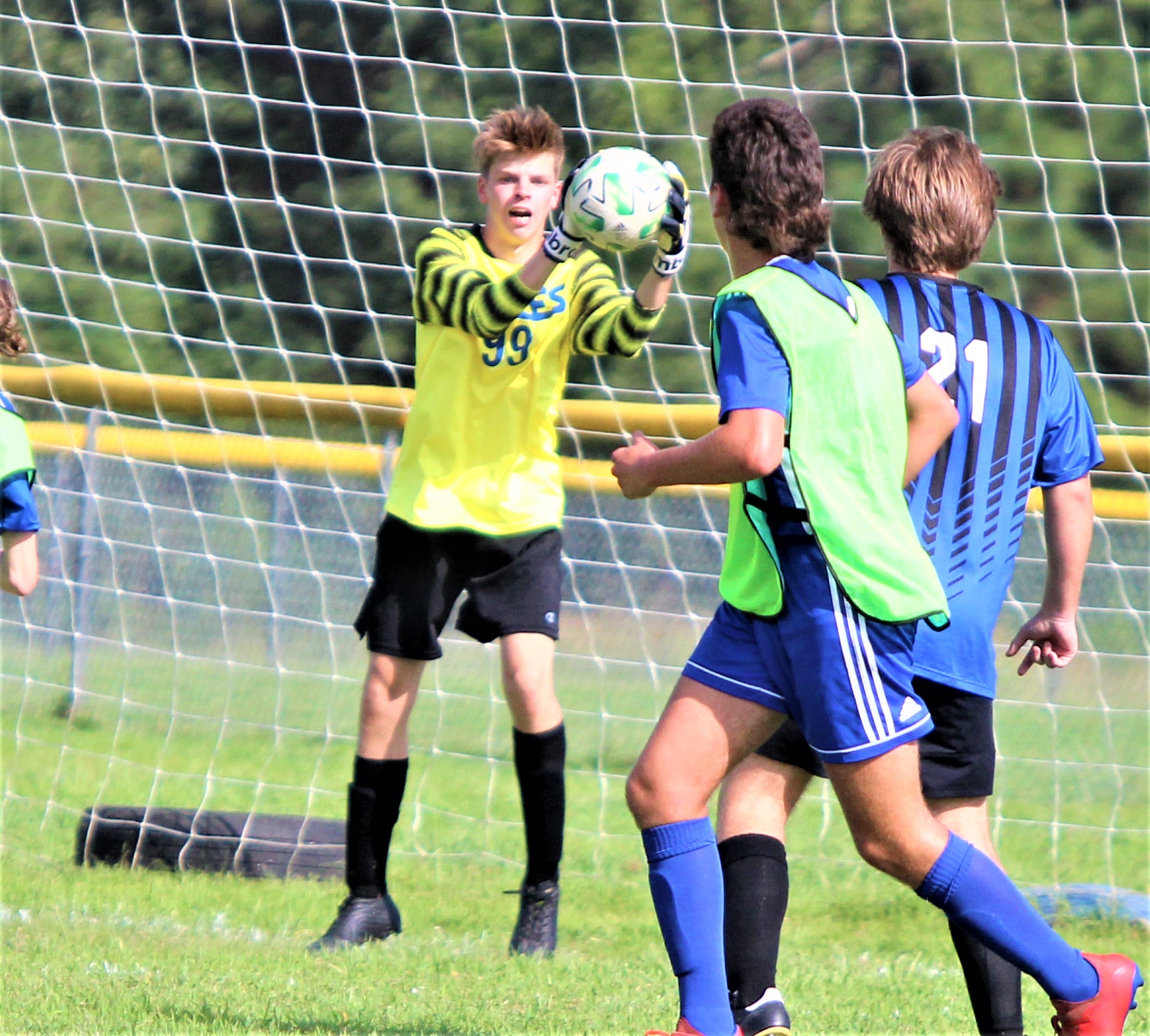 Eagles rally to take soccer opener