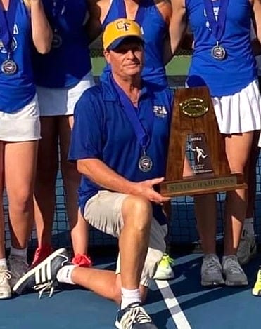 Coach Jackson taking good care of girls tennis state championship trophy